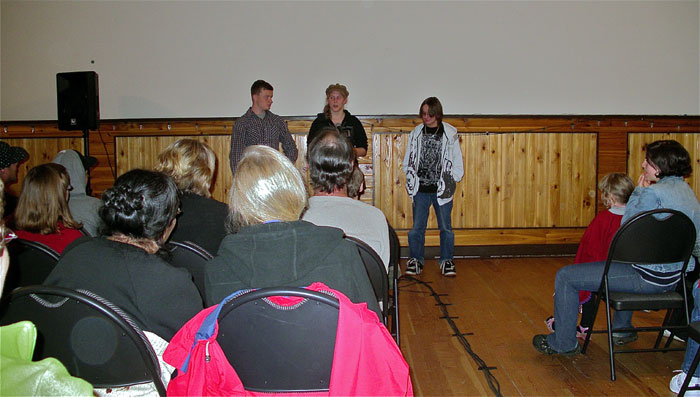 3 people giving a presentation in the hall