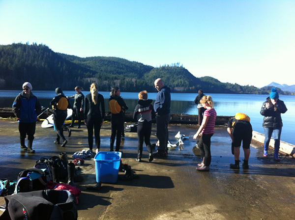 Students receiving paddle board instruction from Shelly. 